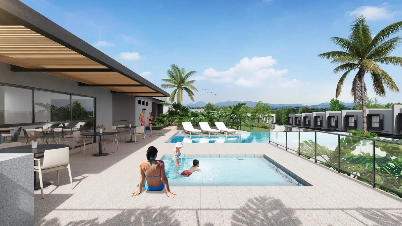 Club House residencial con piscinas y espacios de descanso en Brassia Campestre de Constructora CAMU